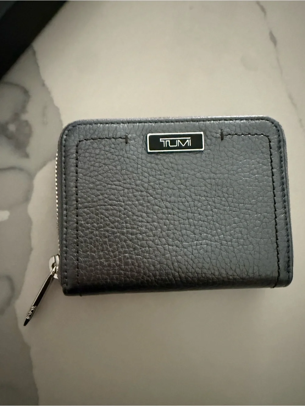 Tumi Gun Metal Wallet with Silver Logo and Zipper